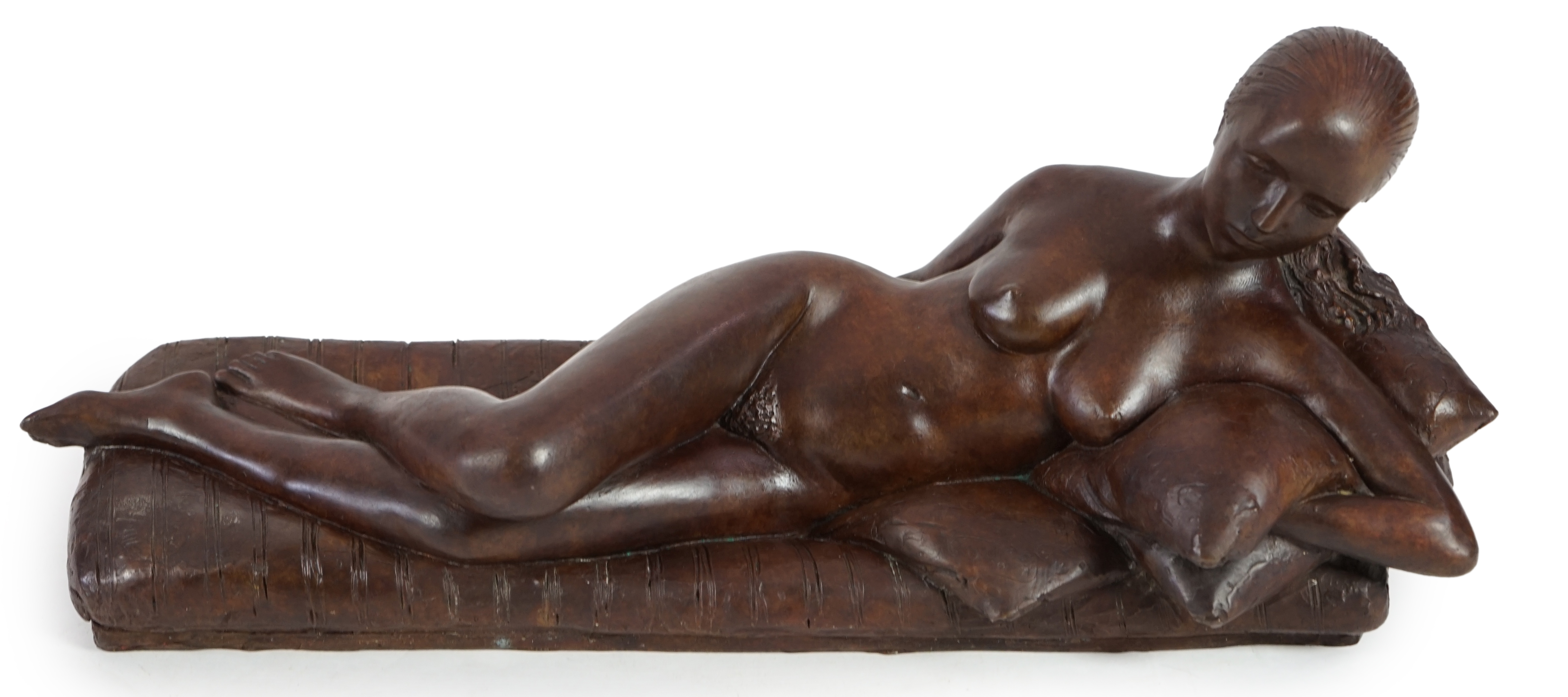 James Butler (1931-2022). A bronze figure of a female nude reclining upon cushions